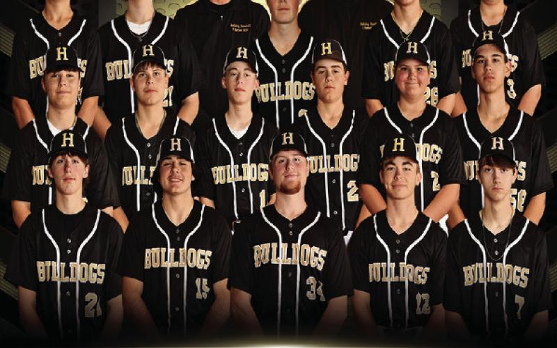 HHS BULLDOGS baseball team pictured above from left to right: Front row Gage Dunigan, Laine Dupuis, Nathan Edwards, Carter Pentecost, and Cayden Breland. Second row Elijah Webb, Bryce Butts, Corbin Nugent, Braden McGuffee, Jake Book, and Landon Wiley. Third row Kaleb Stewart, George Bacon, Coach Luke Pentecost, Tate Tiffee, Coach Ty White, Dominic Stott, and Maddux Trisler.