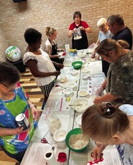 MARKAYE RUSSELL, LSU AgCenter Nutrition and Community Health Agent, Ouachita/Union Parishes pictured above demonstrating making homemade bread with group adults at Union Parish Library.)