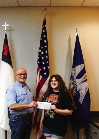 Towell receives check from Sheriff Edwards for scholarship