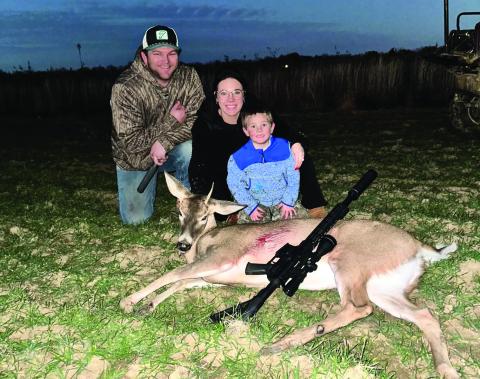 RIVER KNAPP poses with his parents in picture above,