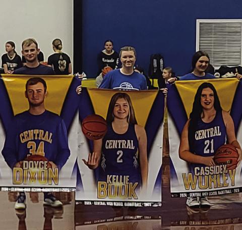 CENTRAL HIGH SCHOOL seniors pictured above with their banner is Doyce Dixon, Kellie Book, and Cassidey Wurley.