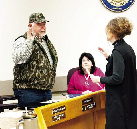 Donald Wayne Meyers sworn in as Police Jury President by Clerk of Court Larisa Field.