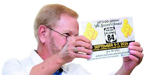 LAVELLE EVANS, Sales Along 84 founder, displays an informational brochure his committee printed and distributed along the route encouraging more people to participate in the event this year.
