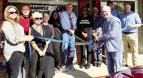 HARRISONBURG’S MAYOR, Mike Tubre, cuts the ribbon for the new clinic.