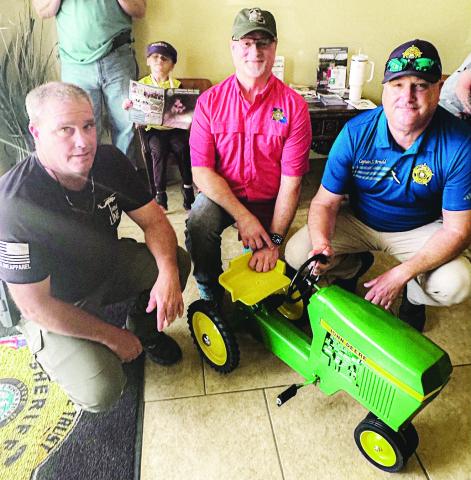 CPSO TOOTIE COOPER, (left) along with CPSO Sheriff Toney Edwards (center), and LPSO Joel Arnold at right, pictured here with restored family heirloom John Deere tractor.