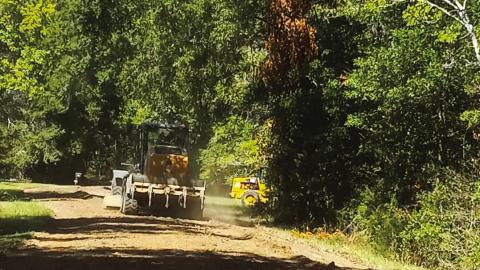 Police Jury employees work to repair roads