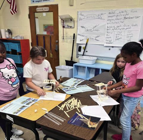 Jonesville Elementary students building bridges and discovering the forces that work on them
