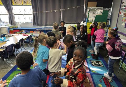 JES SCIENCE for Kindergarten Mrs Lisa Caters' kindergarten class read about pollination and reenacted bees pollinating flowers by tapping on each other's shoulders.