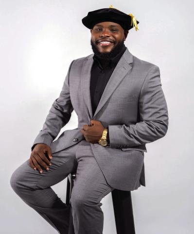 Local scholar celebrates with doctoral degree