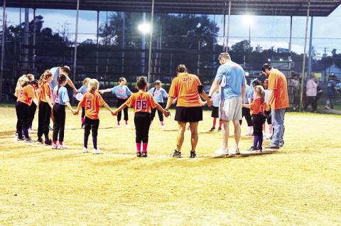 CLB The Community Bank and Brooks Drugs softball teams compete