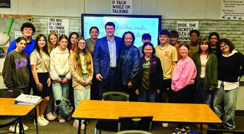 ADAM TERRY pictured above with HHS Quest for Success students and Instructor Ms. Sharon Gilmore.